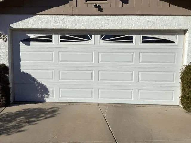 Garage door opener repair technicians fixing automatic garage door systems in Plano TX.
