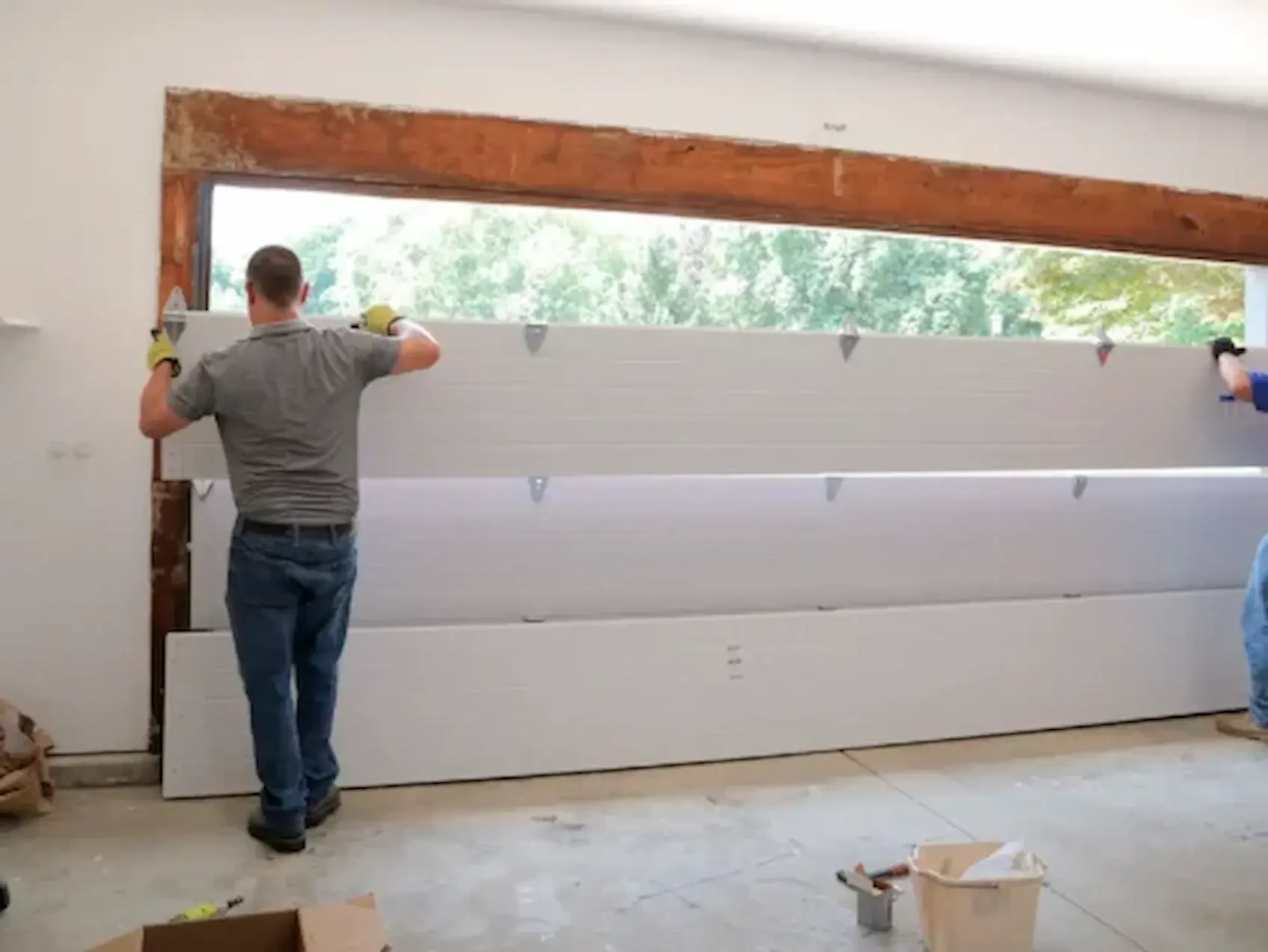 Sectional garage door panel repair service in Garland TX with alignment correction and replacement solutions.