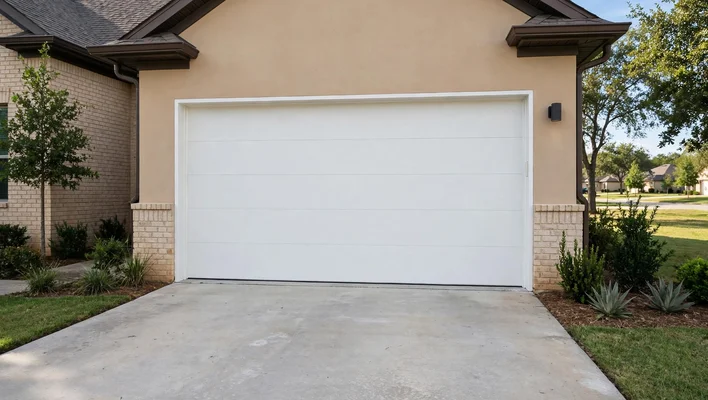 Garage door with a new panel after replacement in Oaks of Firewheel, Garland TX
